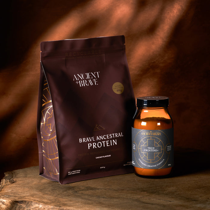 A bag of Ancient + Brave Rose’s Power Ritual is displayed on a wooden surface with warm lighting, highlighting an essential element for your daily vitality.