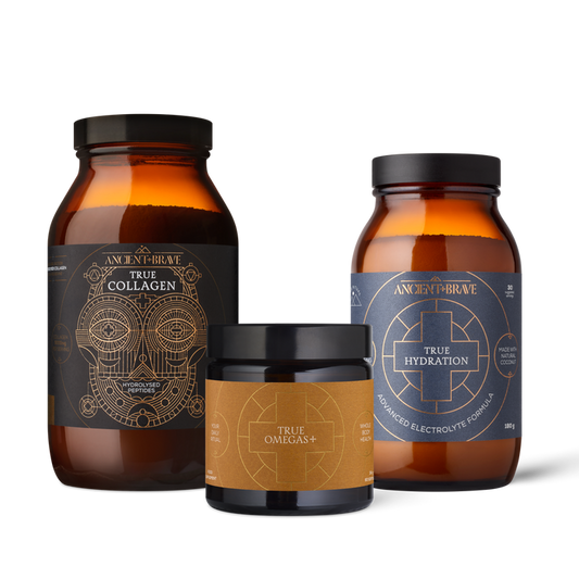 Three supplement bottles labeled 'True Collagen', 'True Omegas+', and 'True Hydration' on a white background.