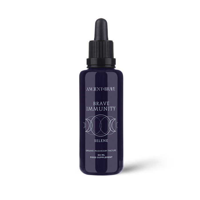 Purple bottle labeled 'Brave Immunity' on a white background