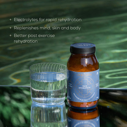 A glass of water and a jar labeled Ancient + Brave Dawn To Dusk Duo sit on a reflective surface, with text highlighting benefits: rapid rehydration, revitalization for mind, skin, and body, and enhanced post-exercise replenishment. Whether you’re reaching for the Dawn To Dusk Duo after a workout or winding down your evening with this powerful pair from Ancient + Brave, experience optimal rehydration that supports your well-being all day and night.
