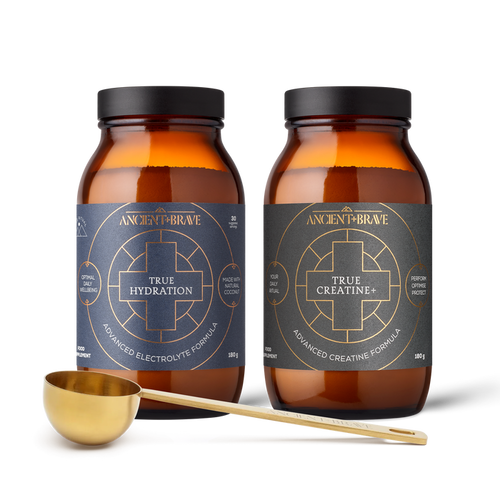 Two bottles of Ancient & Brave supplements with a measuring spoon on a white background