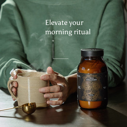 A person in a green sweater holds a steaming mug next to a jar of Ancient + Brave True Collagen, with a gold spoon resting on the table. Text reads: Elevate your morning ritual—with hydrolysed bovine collagen for daily wellness.