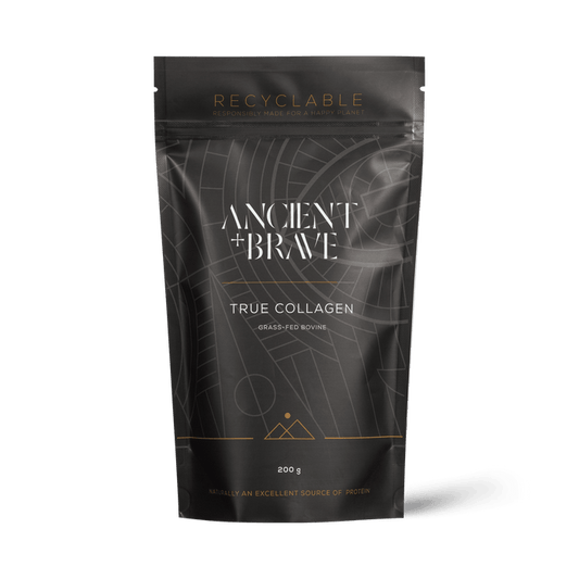 A premium black and gold pouch labeled “Ancient + Brave True Collagen” contains 200g of Type I hydrolysed bovine collagen peptides, sourced from grass-fed cattle. The packaging features geometric patterns, displays both protein content and recyclability, positioning True Collagen as a standout among supplements from Ancient + Brave.