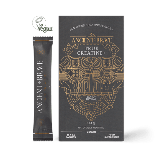 A black box and sachet of Ancient + Brave True Creatine+ Sachets, featuring gold geometric face artwork. The vegan, advanced creatine formula supports energy and cognitive health with a naturally neutral taste.