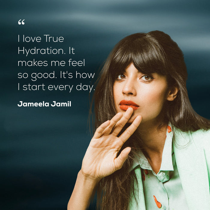 A woman with long dark hair and bangs poses with her hand raised. Text beside her reads: I love Ancient + Brave True Hydration Sachets. With their coconut water electrolytes, they make me feel so good. It’s how I start every day. Jameela Jamil.