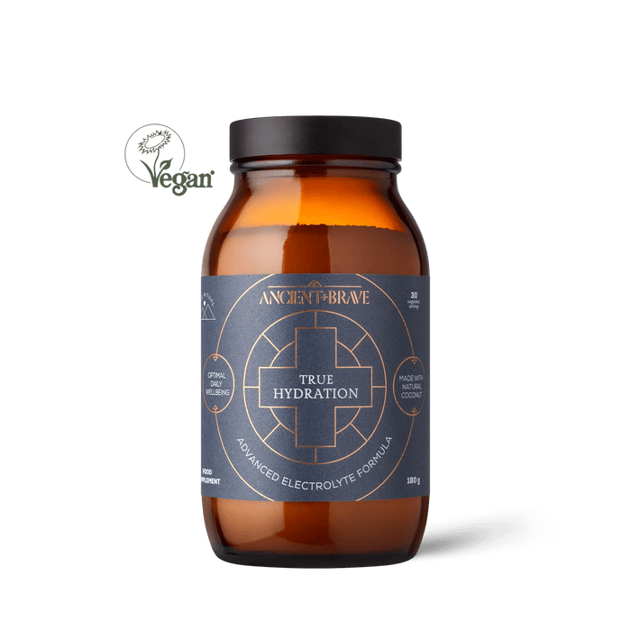 A brown bottle labeled 'True Hydration' by Ancient + Brave with text describing the product as an advanced electrolyte formula.