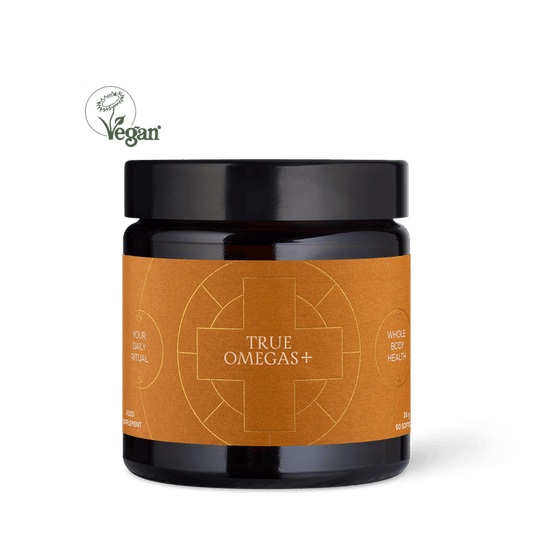 A jar of True Omegas+ supplement with a label featuring a sun and rays design, predominantly in orange and white colors.