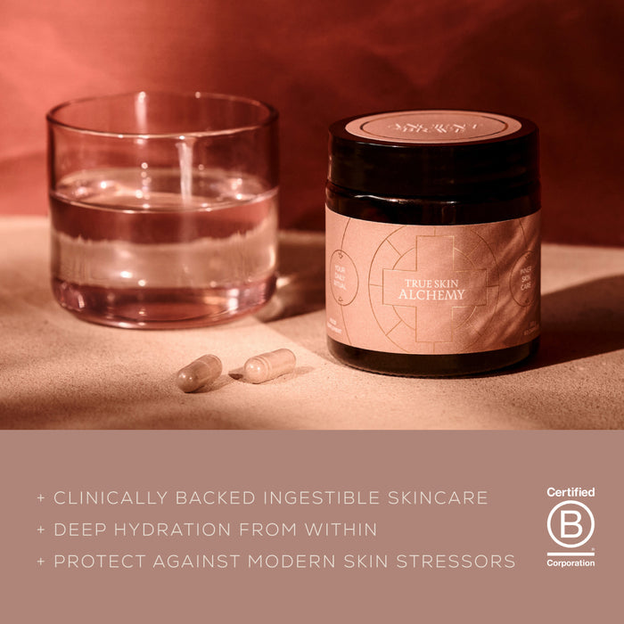 A jar labeled Ancient + Brave True Skin Alchemy, a glass of water, and two capsules rest on a pink surface, with text highlighting this ingestible skincare made with clinically studied ingredients designed to deliver deep hydration and protect skin from stressors. Certified B Corporation logo visible.