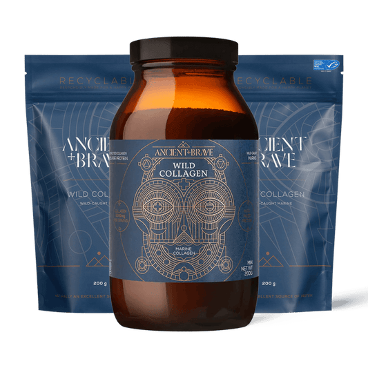 An amber glass jar of Ancient + Brave Wild Collagen centered in front of two blue resealable pouches on a black background.
